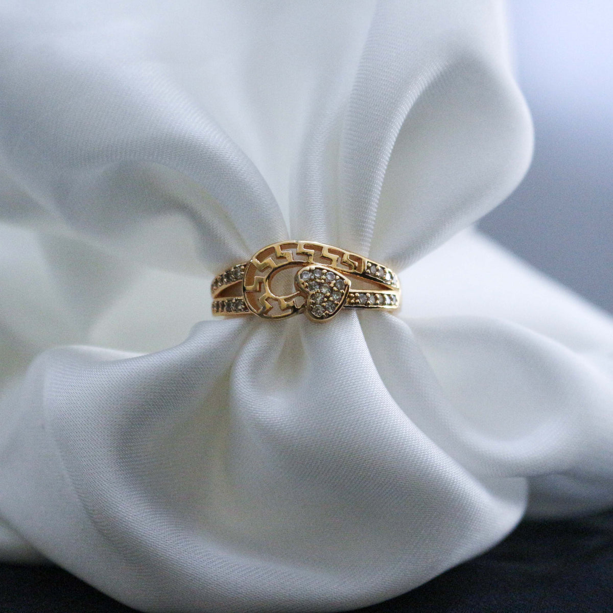 Golden ring with heart design