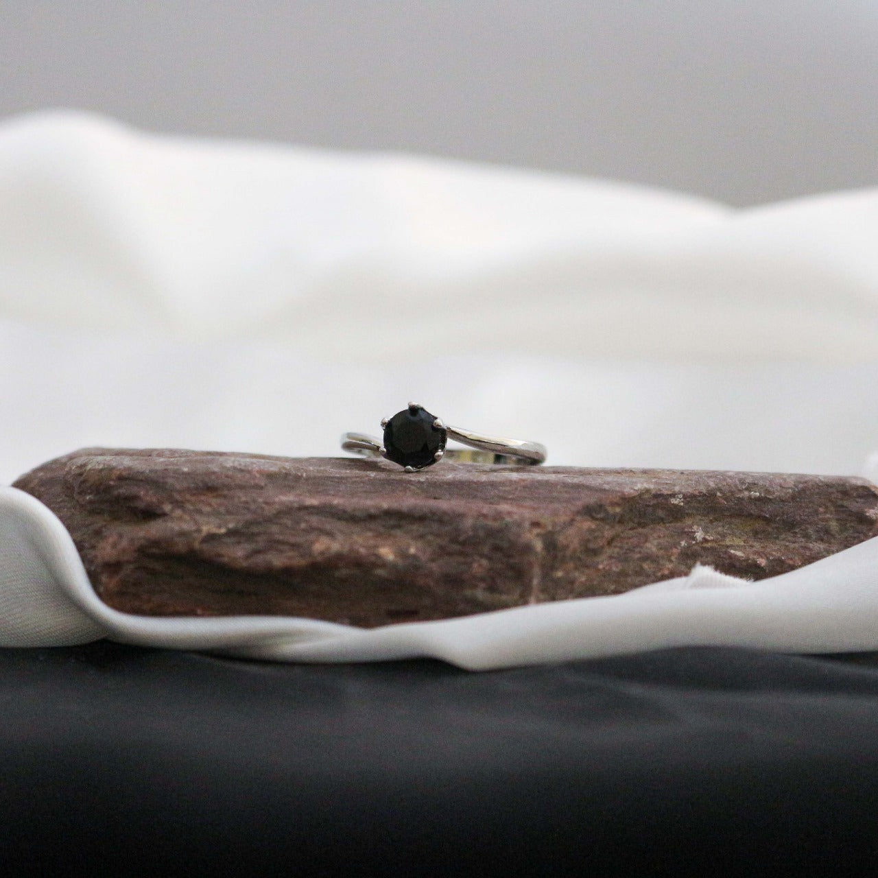 Ring with a black gemstone