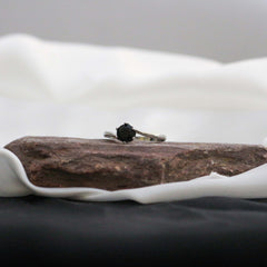 Ring with a black gemstone
