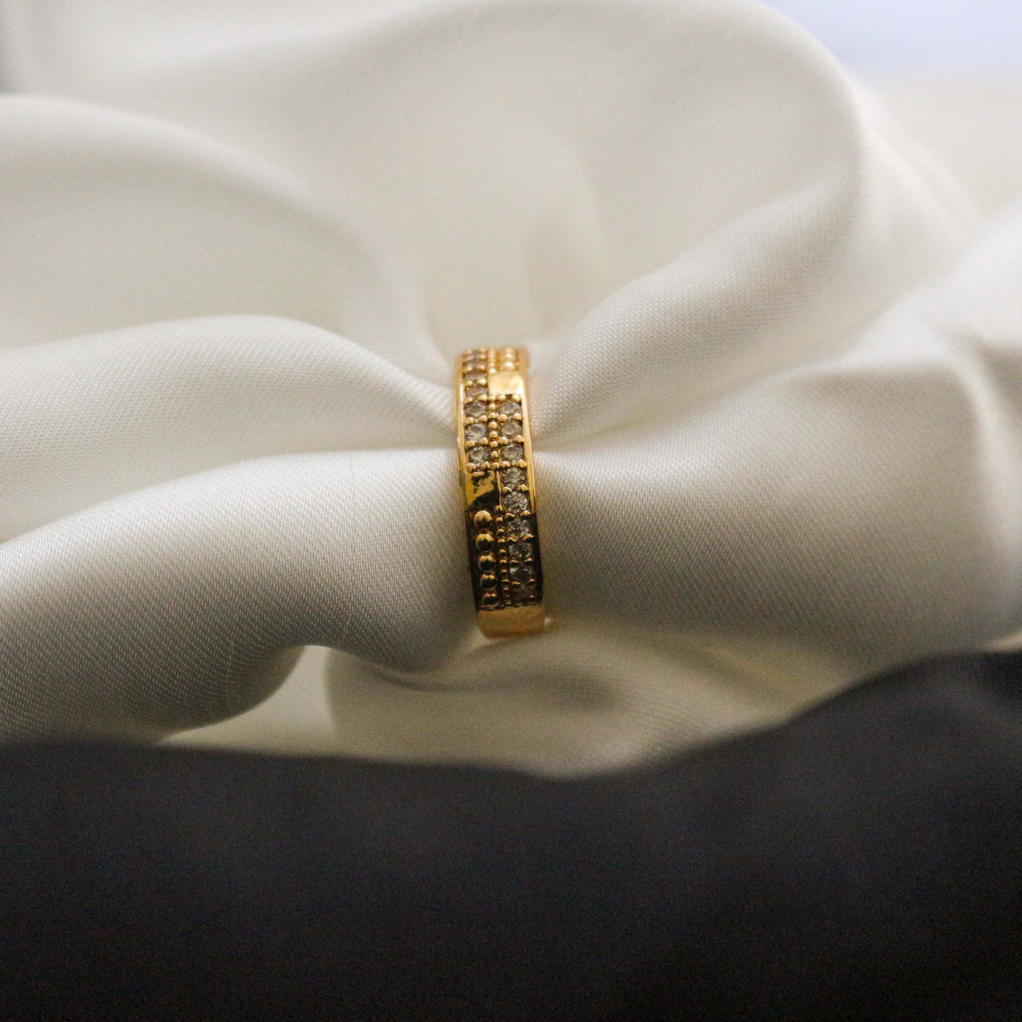 Golden ring with engraved design