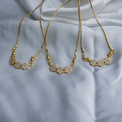 Golden necklace with floral designs
