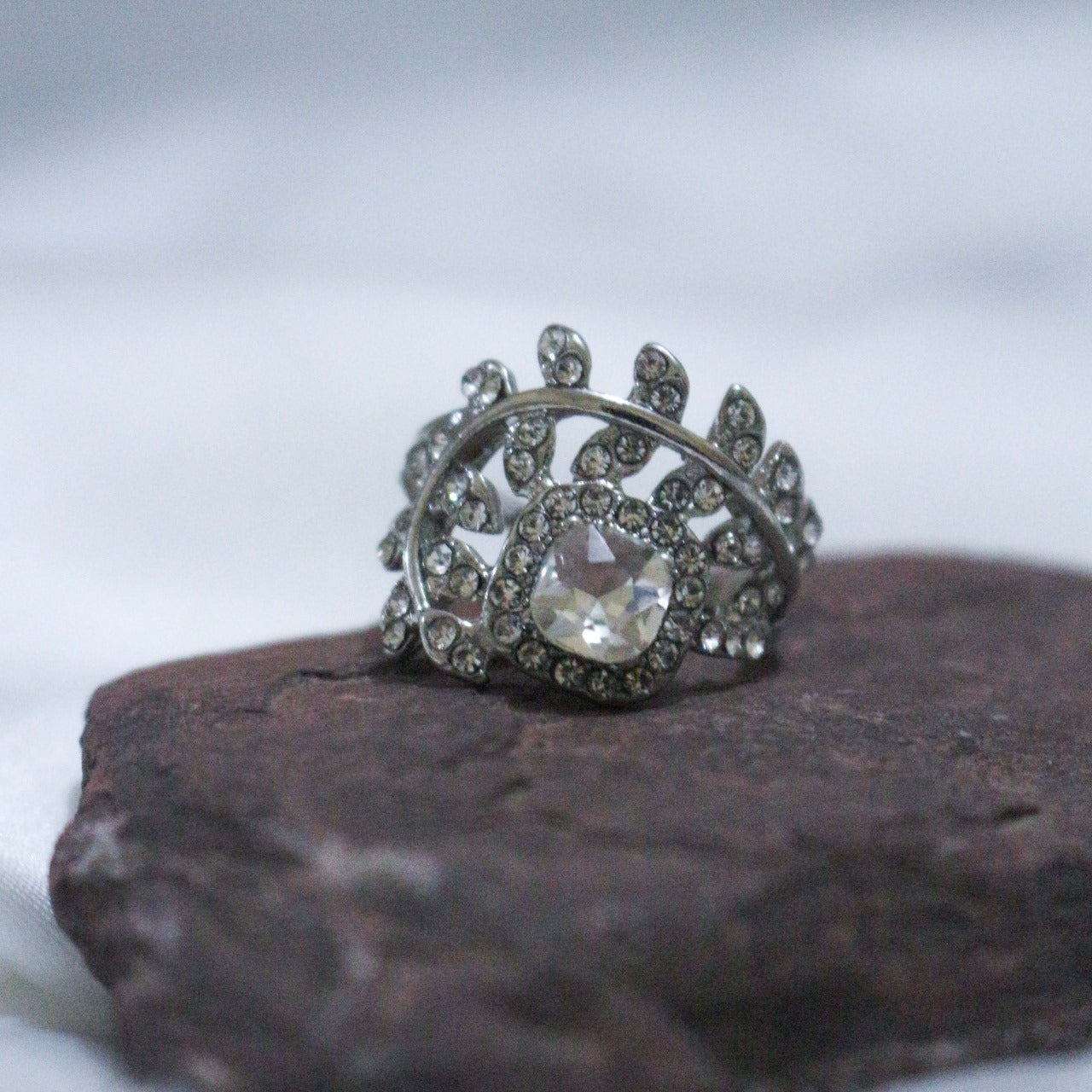 Silver ring with a large central gemstone