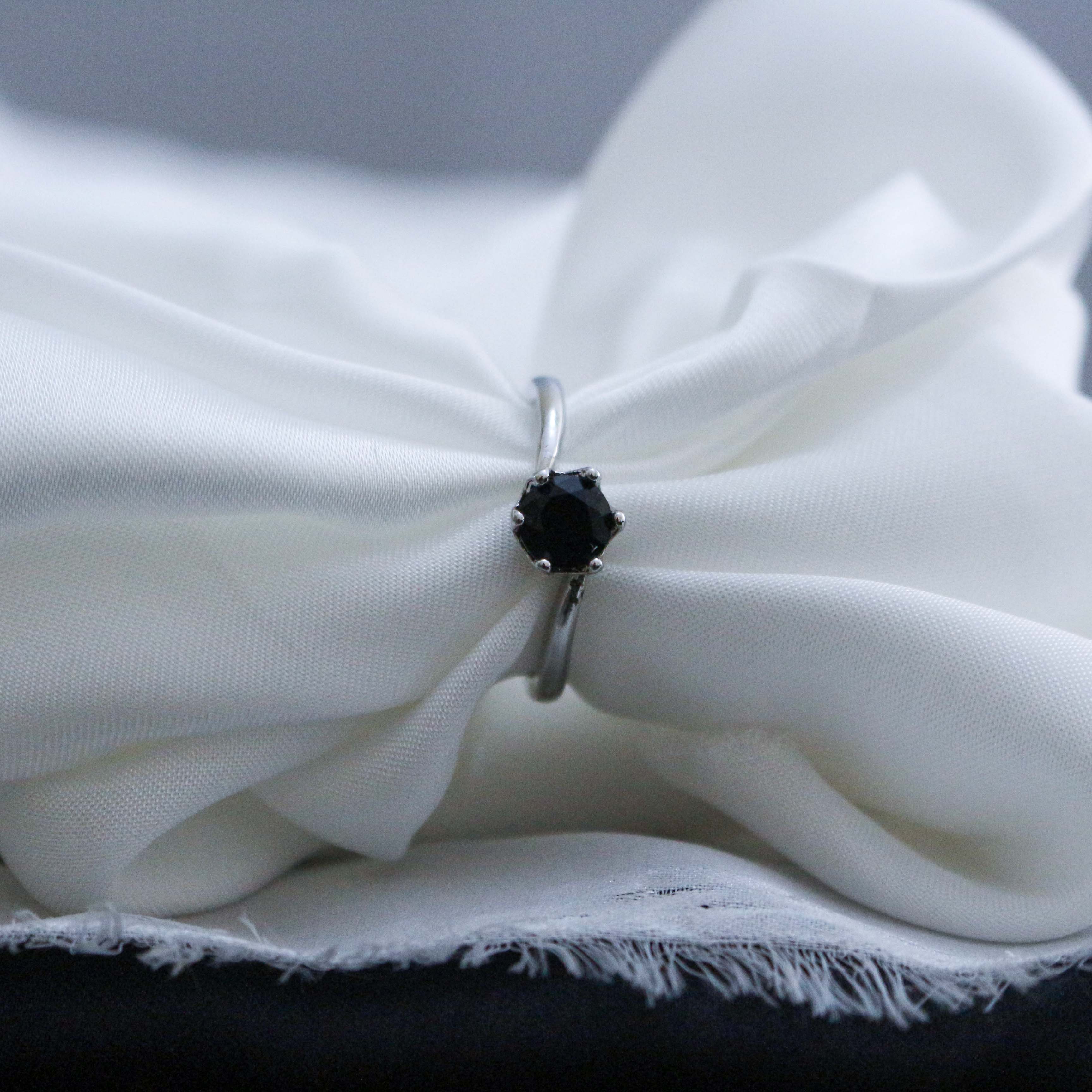 Silver ring with a black gemstone
