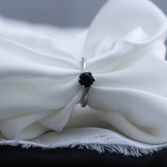 Silver ring with a black gemstone